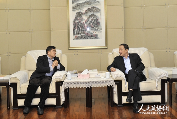 北京市東城區政協主席邵鵬（右）與人民政協報社黨組書記、總編輯周北川