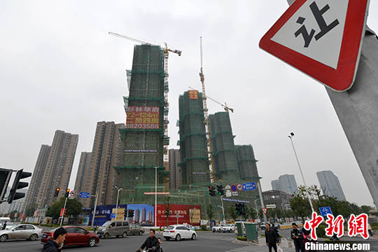 資料圖：一處商品房在建中。 <a target='_blank' href='http://www.chinanews.com/'>中新社</a>記者 呂明 攝