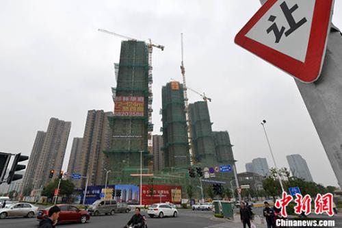 資料圖：一處商品房在建中。 <a target='_blank' href='http://www.chinanews.com/'>中新社</a>記者 呂明 攝