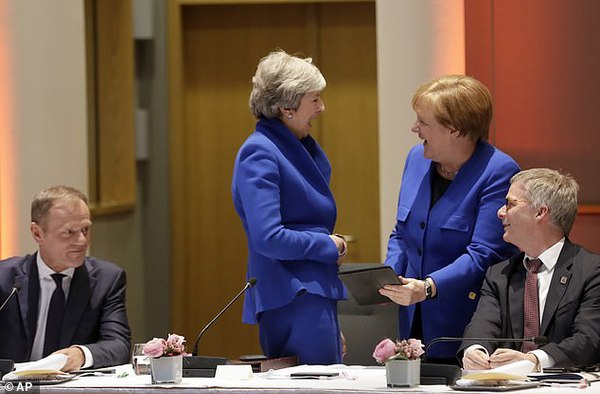 12107910-6908511-Mrs_May_shared_a_joke_with_German_chancellor_Angela_Merkel_tonig-a-25_1554920325555.jpg