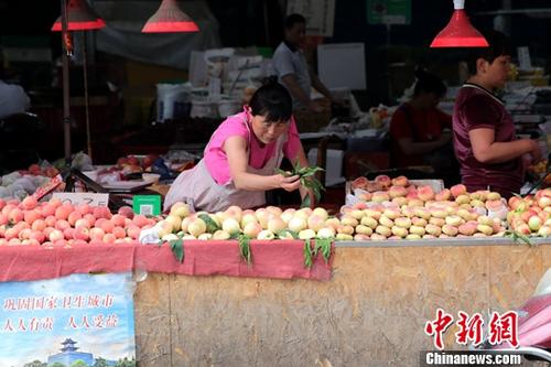 資料圖：菜市場商家。<a target='_blank' href='http://www.chinanews.com/'>中新社</a>記者 張遠 攝